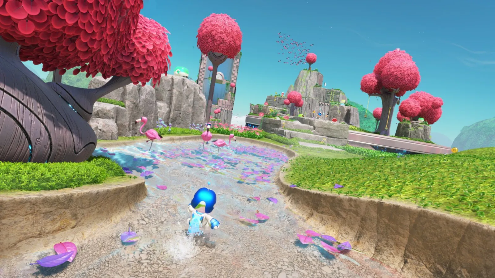 Astro corre por un nivel de árboles rosas y plataformas flotantes en Astro Bot