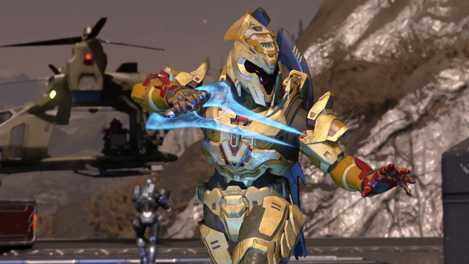 Un Spartan con armadura dorada empuña una espada de energía junto a un helicóptero en Halo Infinite