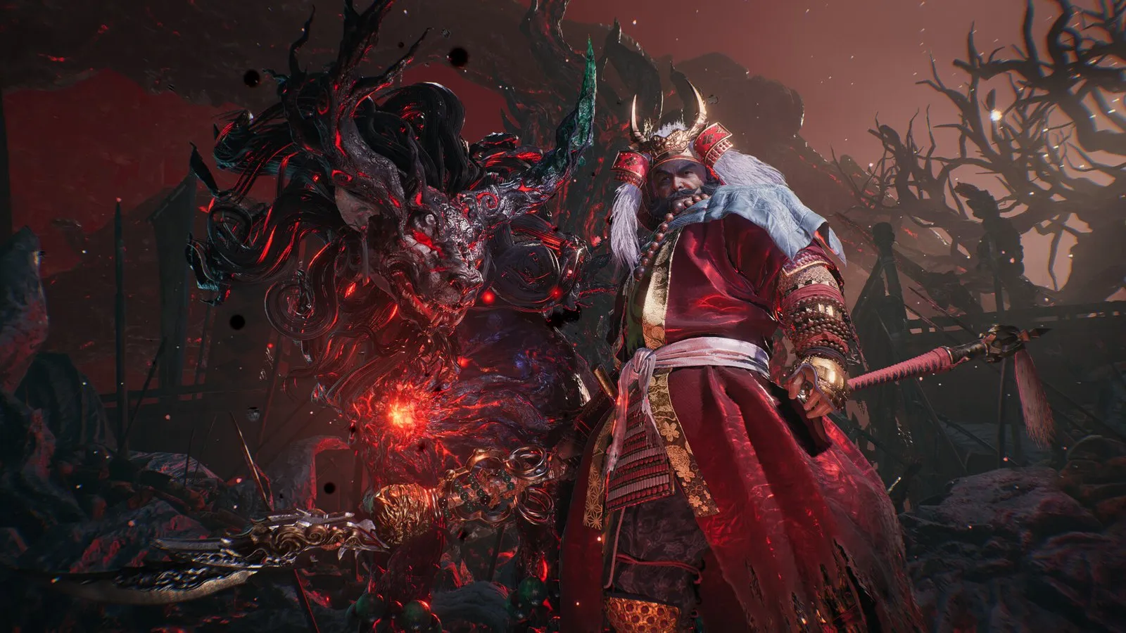 Un demonio rojo con cuernos se enfrenta al protagonista en una cueva en Nioh 3