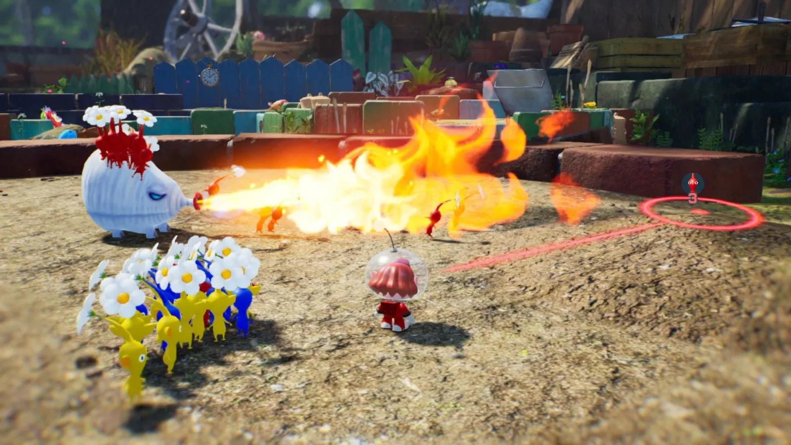 Un grupo de Pikmin rojos ataca a un bulbo gigante entre llamas en Pikmin 4