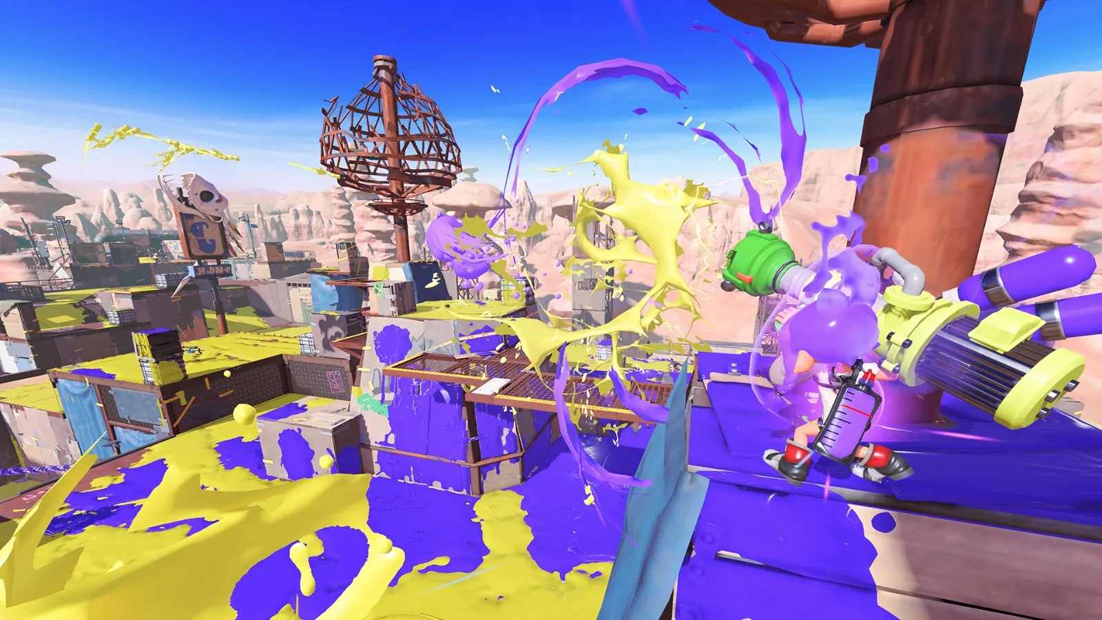 Una batalla territorial con tinta morada y amarilla por todo el escenario en Splatoon 3