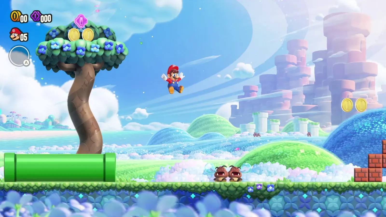 Mario salta entre plataformas verdes en un nivel del Reino Flor en Super Mario Bros. Wonder