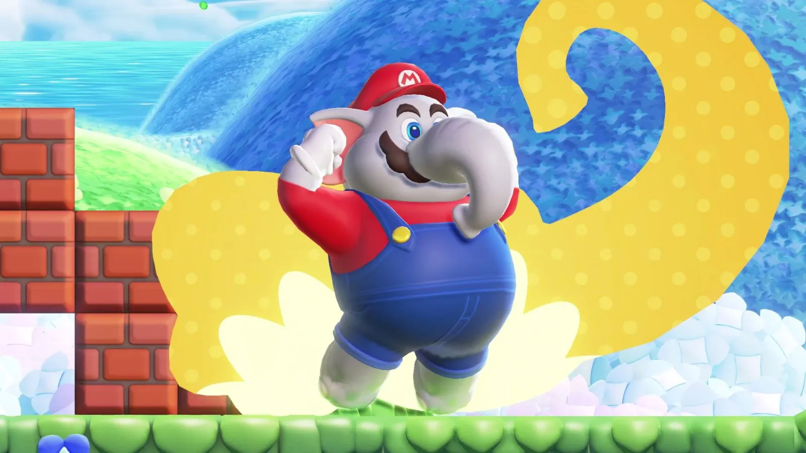 Mario elefante salta junto a un muro de ladrillos en Super Mario Bros. Wonder