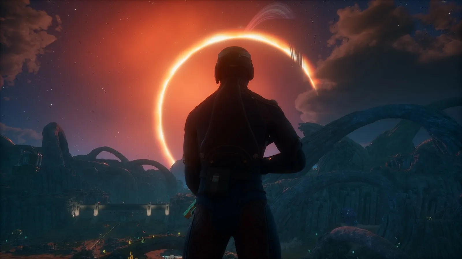 El protagonista contempla un eclipse sobre un paisaje alienígena en The Outer Worlds 2