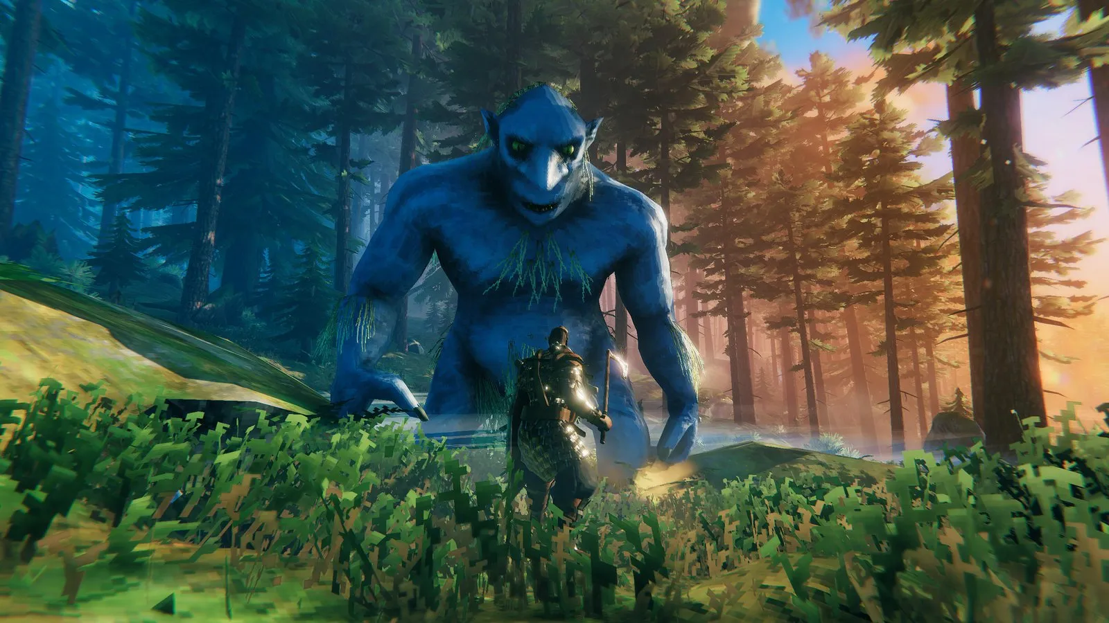 Un trol azul gigante avanza entre los árboles de un bosque en Valheim