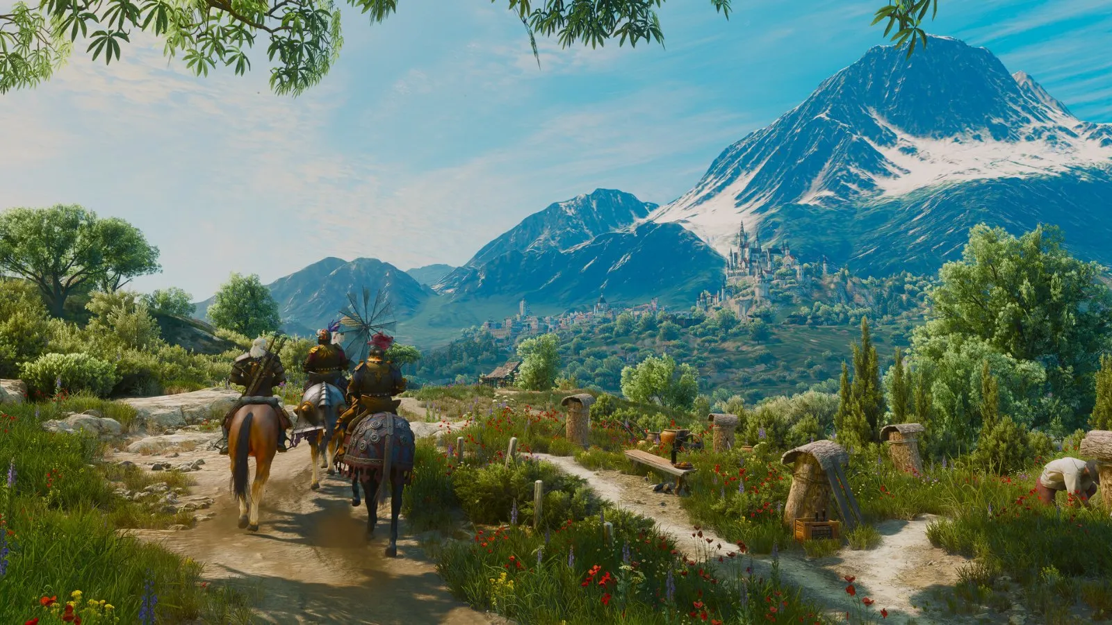 Geralt cabalga por un valle con montañas al fondo en The Witcher 3: Wild Hunt — Remastered